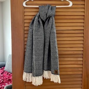 This is an alpaca scarf made by Campo. It’s one size fits all. Never worn.